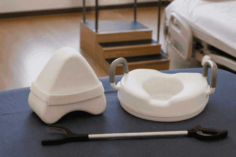 Abductor pillow and raised toilet seat in a rehab setting.